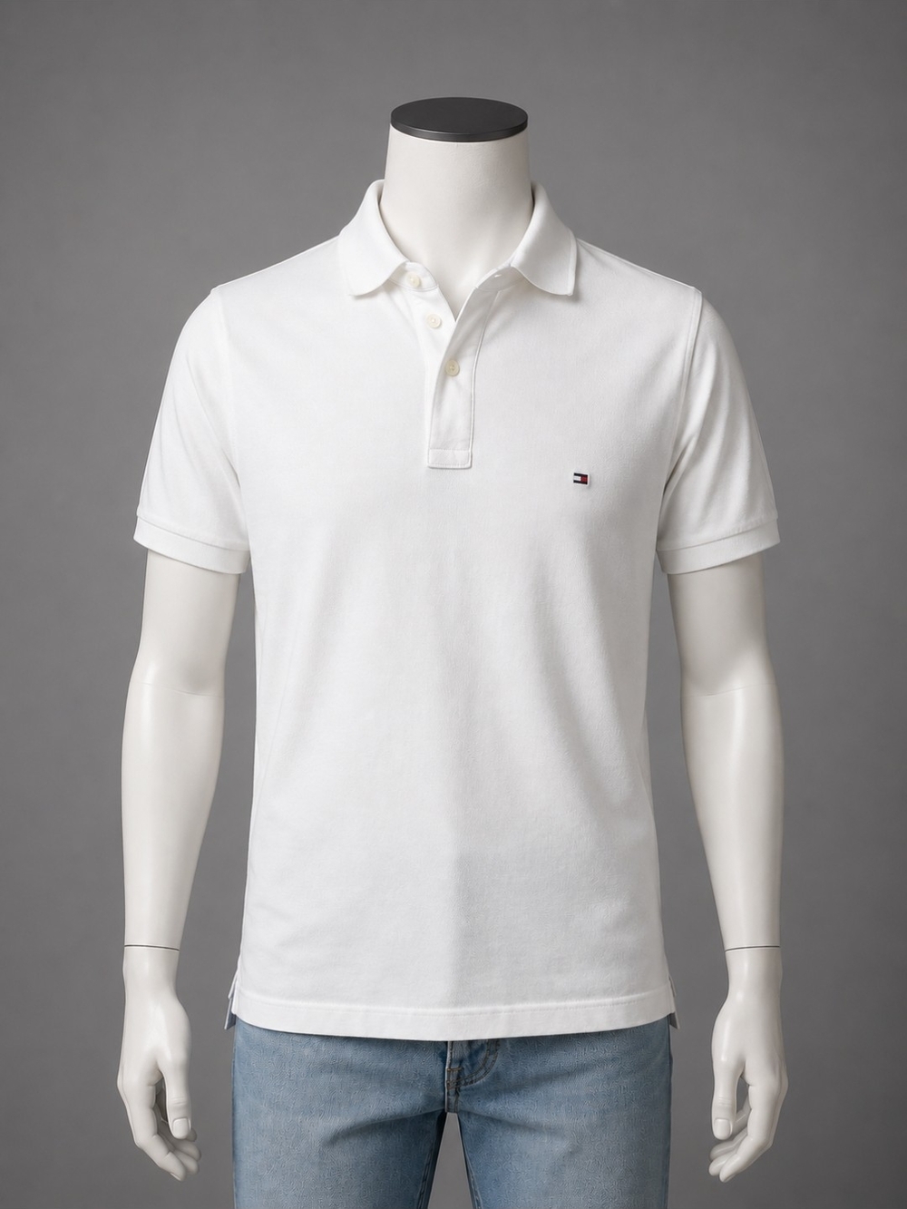 Clean and versatile Tommy Hilfiger polo shirt featuring soft 100% cotton pique